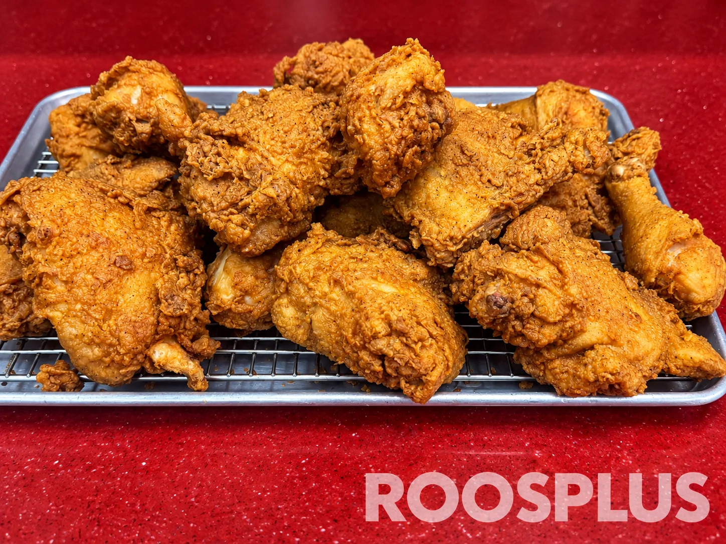 A tray of golden fried chicken pieces with textured breading at Bismillah Pizza, Eglinton Avenue East, Scarborough.