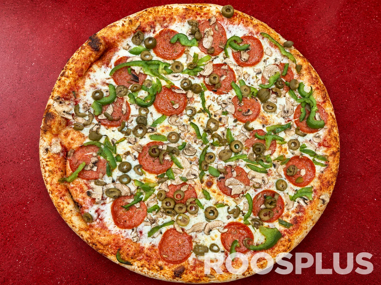 Cheese pizza with salami slices, green peppers, mushrooms and green olives at Bismillah Pizza, Eglinton Avenue East, Scarborough.
