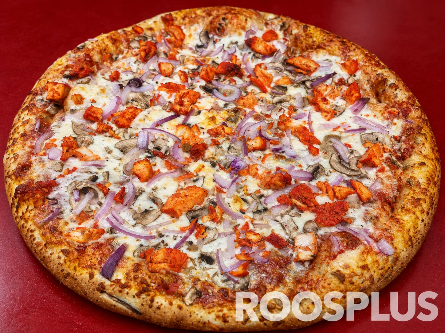 Cheese pizza topped with orange chicken pieces, mushrooms and sliced red onion at Bismillah Pizza, Eglinton Avenue East, Scarborough.