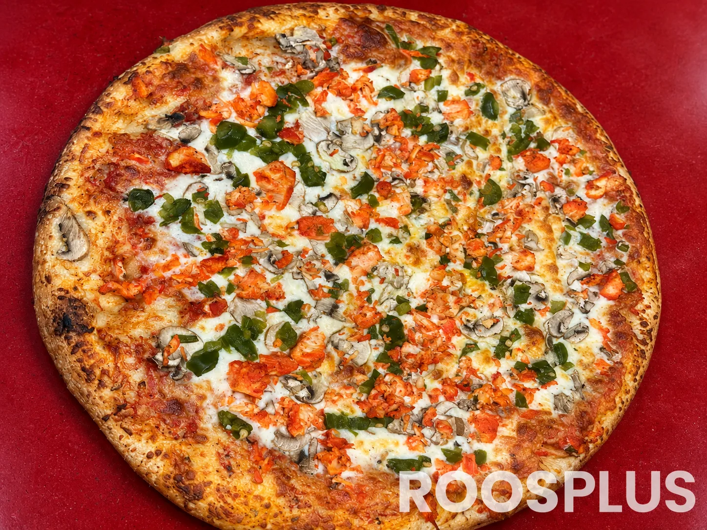 Pizza topped with chicken pieces, mushrooms and green peppers at Bismillah Pizza, Eglinton Avenue East, Scarborough.