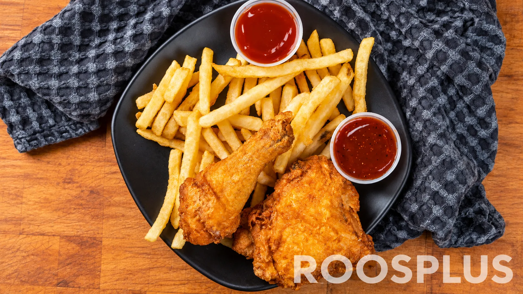 Two fried chicken pieces served with French fries and dipping sauces at Bismillah Pizza, Eglinton Avenue East, Scarborough.