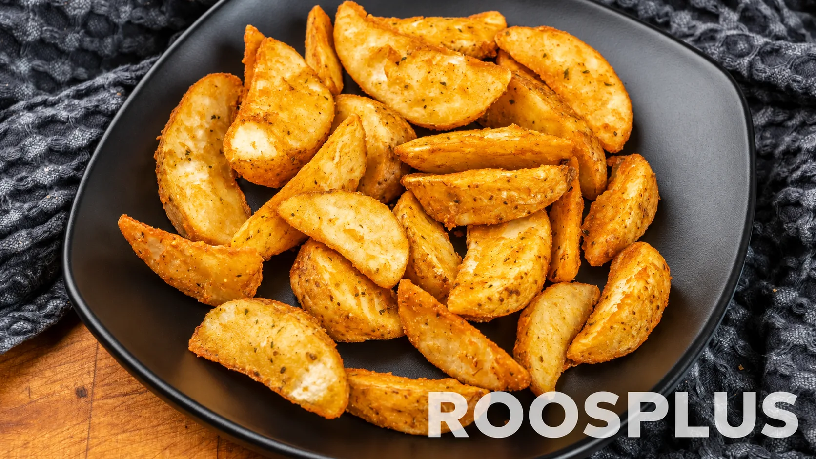 Golden skin-on potato wedges arranged on a dark plate at Bismillah Pizza, Eglinton Avenue East, Scarborough.