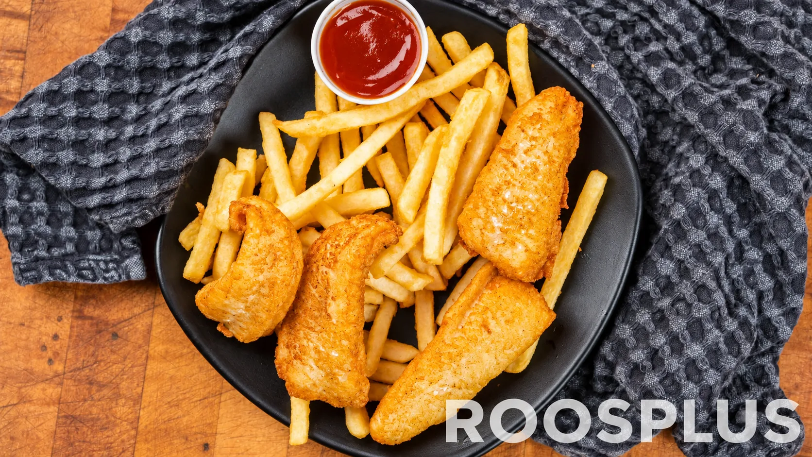 Battered fish pieces with French fries and a red dipping sauce at Bismillah Pizza, Eglinton Avenue East, Scarborough.